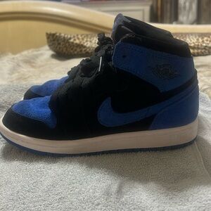Blue and black Nike Jordan 1’s.  Size 1 youth
